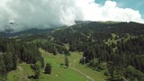 Beautiful valley in Altai mountains, aerial view. Mountain taiga, mountains in the clouds, Altai