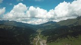 Beautiful valley in Altai mountains, aerial view. Mountain taiga, mountains in the clouds, Altai