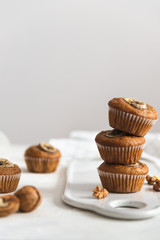 Stack of Homemade vegan banana walnut muffins. Side view, copy space