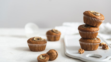 Healthy vegan oat muffins, apple and banana cakes on a wooden background. Copy space, Bakery concept