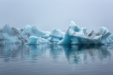 Jokulsarlon Glacier Lagoon of Iceland, amazing nature with blue ice and reflection in the water, popular tourist attraction