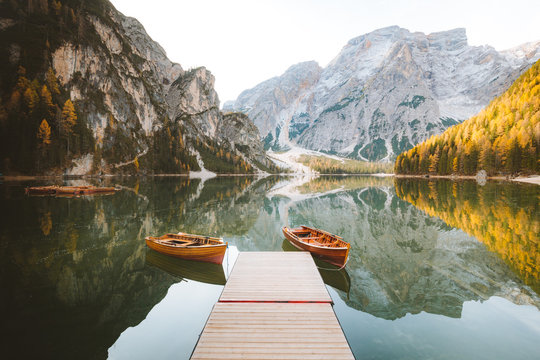 Traditional rowing boats at Lago di Braies in the Alps in fall