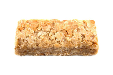 Caramel ground peanuts bar isolated on white background.Caramel peanut powder candy bar isolated