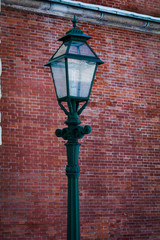 vintage lantern on brick wall background