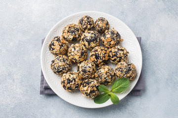 Healthy energy balls made of dried fruits and nuts with oatmeal and muesli . Raw vegan candy.