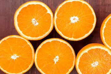 An overhead closeup photo of fresh orange halves