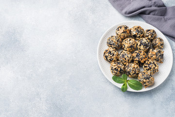 Healthy energy balls made of dried fruits and nuts with oatmeal and muesli . Raw vegan candy.