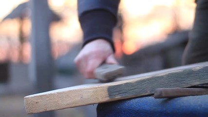 man polishing wood master board slow motion