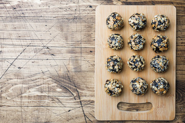Healthy energy balls made of dried fruits and nuts with oatmeal and muesli . Raw vegan candy.
