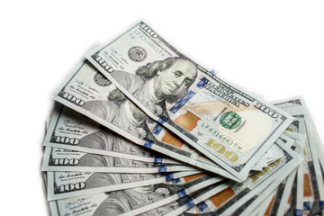 fan of new hundred dollar bills isolated on white background close up