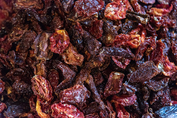 Top view of dried tomtoes slices food background texture