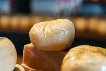 Different sort of cheeses on a wooden board for sale