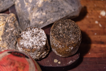 Different sort of cheeses on a wooden board for sale
