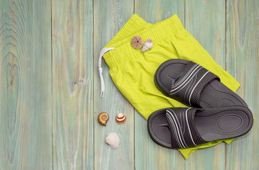 Men's beach accessories on a wooden background