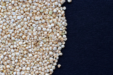 quinoa croup  on black surface close up