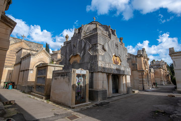 Old crypts and tombs in baroque style in Old Roman cemetery park (Cimitero Storico) in Lecce, Puglia, Italy. A region of Apulia