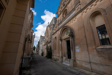 Old crypts and tombs in baroque style in Old Roman cemetery park (Cimitero Storico) in Lecce, Puglia, Italy. A region of Apulia