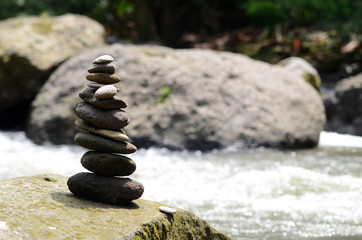 Stacked zen stone at Tegenungan Waterfall