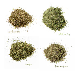 Four kinds of dried spices. Oregano, parsley, marjoram, tarragon. White isolated background. View...
