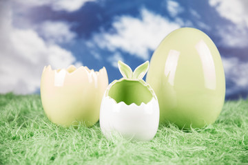 Easter, colorful eggs on green grass.