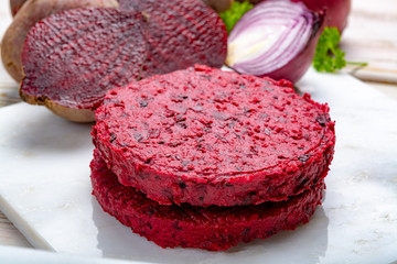 Healthy vegetarian food, raw round burgers made from red beetroot