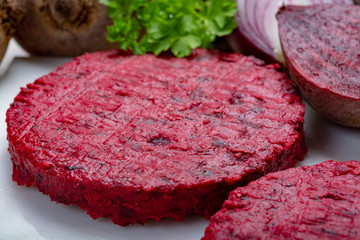 Healthy vegetarian food, raw round burgers made from red beetroot
