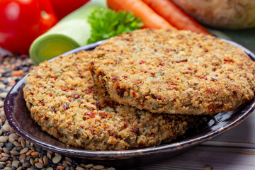 Tasty vegetarian food, raw burgers made from lentils legumes with vegetables ready for cooking