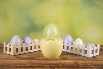Easter, colorful eggs on a wooden table.