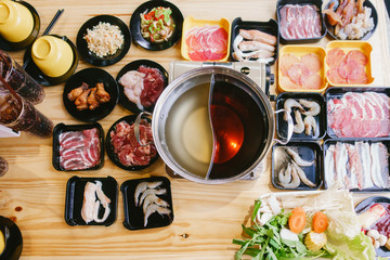 Sukiyaki set,pork,beef,vegetable on  wooden table background.