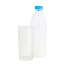 Bottle and glass full of fresh milk.