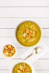 Homemade Broccoli and Chickpea Soup on White Wood