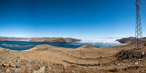 View above big beautiful lake Baikal with Ice floes floating on the water, Russia