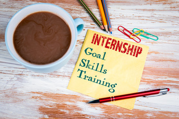INTERNSHIP concept. Text on a napkin with a cup of coffee
