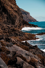 Rocky Cliffs with blue ocean waves