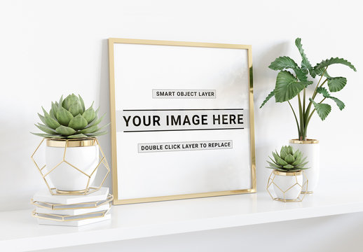 
Square Frame Laying on Shelf With Plants Mockup