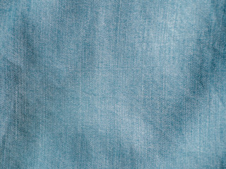 Modern soft jeans blouse texture close up. Lyocell or tencel pattern - modern natural cellulose fabric blue denim color. Can use for design or text. Copy space