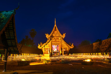 Fototapeta premium People carry the candle and walking around pagada