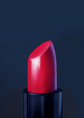 Lipstick. Fashion Red Lipstick over dark background.