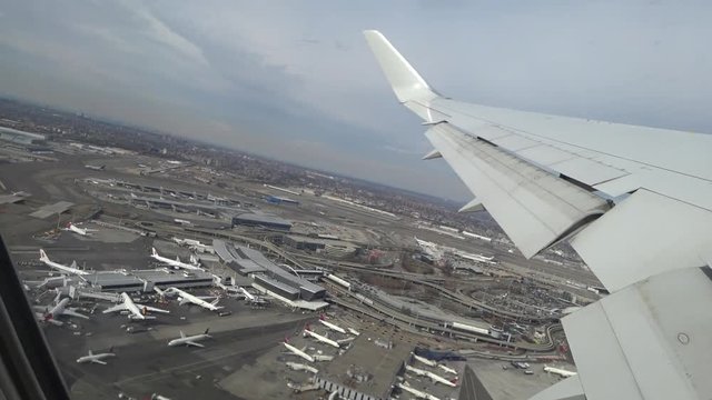 Plane taking off from airport, View through an airplane window