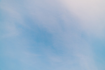 Blue day clear sky with light clouds. Smooth blue white gradient of sky. Wonderful weather. Background of morning. Heaven at morning with copy space. Slightly cloudy backdrop. Atmosphere of clear day.