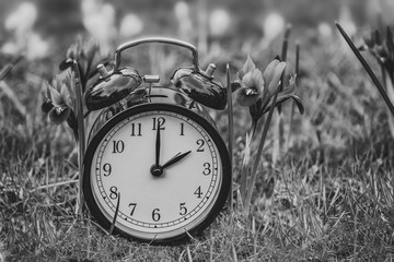 Daylight saving time. Alarm clock switched to summer time. Changing clock from wintertime to...