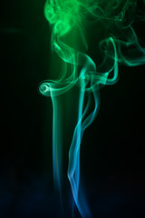 Abstract backgrounds and wallpapers. Colorful smoke on black background.