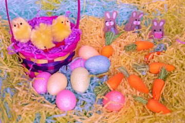 Easter diorama as a background with eggs, bunnies and rabbits.