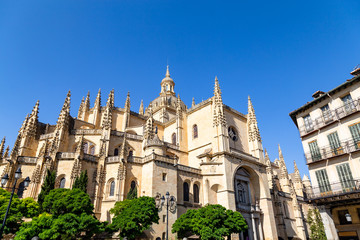 Fototapeta na wymiar Segovia, Spain – Segovia cathedral in a summer day seen from plaza Mayor. It was the last gothic style cathedral built in Spain, during the sixteenth century.