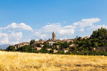 View of Segovia Old Town in Summer from the field next to Iglesia de la Vera Cruz, an ancient Templar church. Castilla Y Leon, Spain