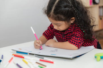 little girl and drawing fun on the paper white