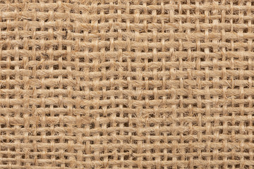 Close up on a burlap texture as abstract background. Copy space for your text.