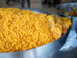 Close up of Homemade Chicken Tikka Biryani, Delicious spicy chicken biryani in big bowl over moody background.