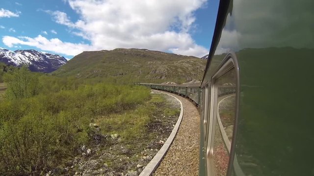 View of Flamsbana Rail Car (Flam Train) Curving Around Breathtaking Mountains in Norway