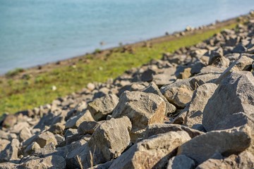Rocks on the riverbank with sping sunshine